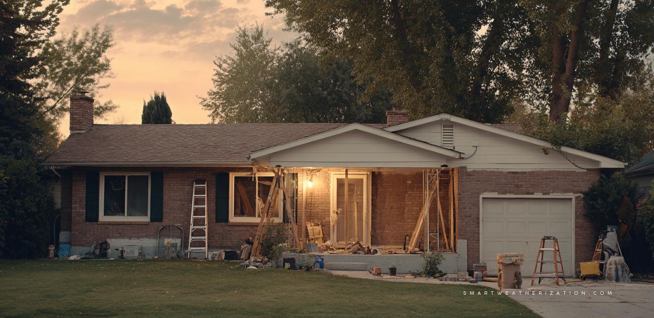 Storm window installation and attic insulation in a mid-century ranch house